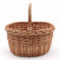 Cesta de mimbre trenzada con asa, ideal para almacenamiento y recolectar setas, tamaño mediano.