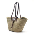 Bolso de playa de palma con asas de cuero, con cremallera y cierre de solapa, ideal para llevar tus esenciales con estilo.